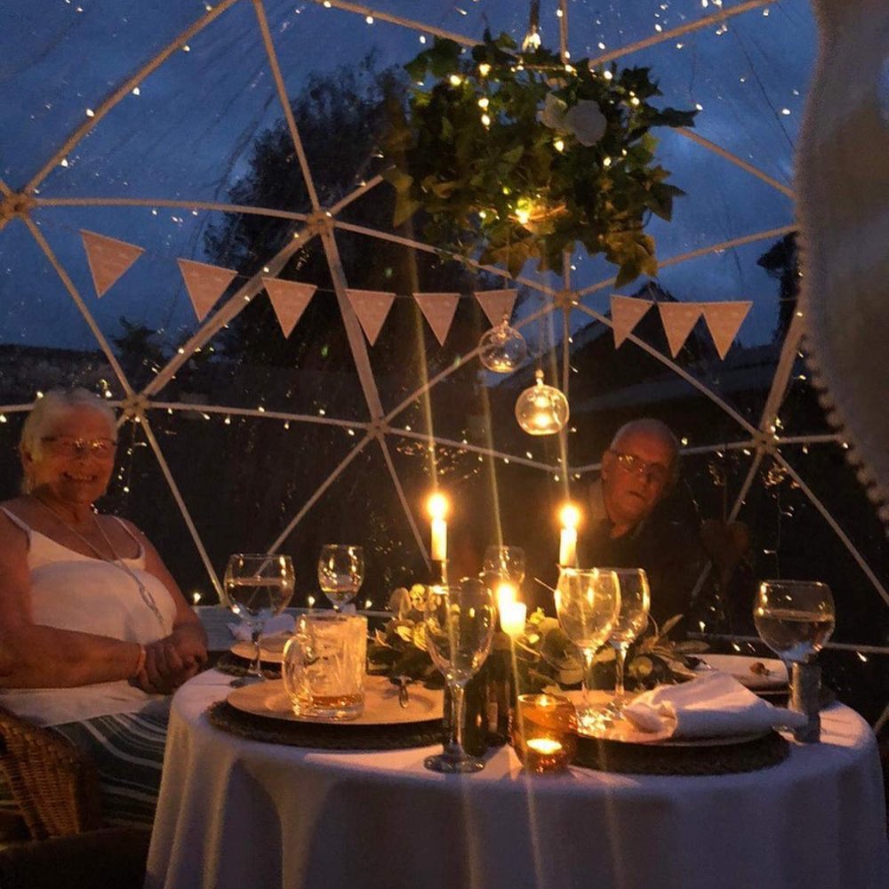 Romantic candlelit dinner for two inside igloo